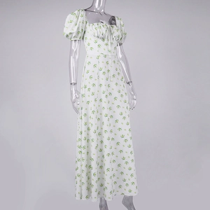 Detail of floral print maxi dress with puff sleeves, square neckline and drawstring ties
