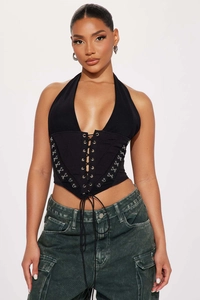 Detail of black halter corset top with front criss-cross lacing and metal hook fasteners