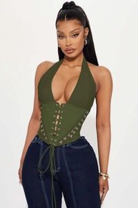 Detailed view of dark green halter corset top with front lace-up design and metal hooks
