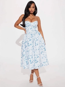 Slim fit tube midi dress with blue floral print and elegant flared skirt on model