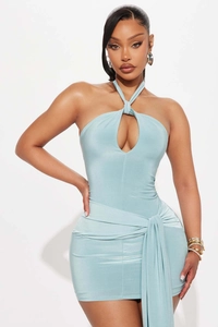 Detail of light blue halter neck dress with front cutout and waist tie accent