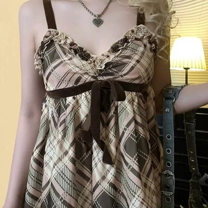 Vintage brown plaid strap dress with ruffle neckline and velvet bow tie waist detail