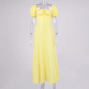 Detail of floral yellow maxi dress with puff sleeves, square neck, and drawstring detail