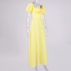 Detailed view of yellow floral maxi dress with puff sleeves and square neckline drawstring
