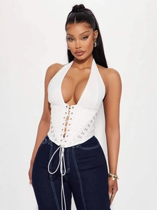 Chic white halter corset top with front lace-up and hook-and-eye details on front view