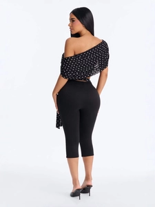 Women's chic black and white polka dot off-shoulder crop top and cropped pants set