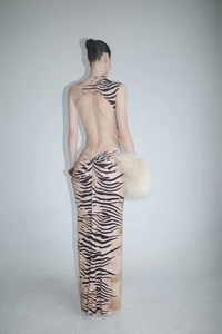 Detail of the backless design and tiger print pattern on this summer maxi dress