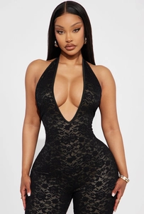 Close-up of intricate floral lace texture on a deep V-neck halter bodysuit