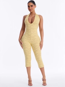 Sexy yellow lace halter jumpsuit featuring a deep V-neck and floral texture for summer