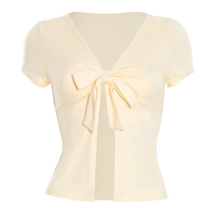 Detail of light beige short sleeve cardigan with V-neck and front bow tie closure
