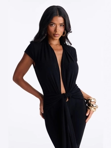 Women's black deep V-neck jumpsuit featuring waist knot detail and golden accessories