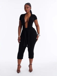 Sexy black deep V-neck short sleeve romper with waist tie and slim fit silhouette