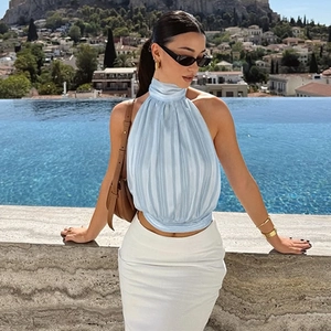 Detail of light blue halter neck top with pleated satin texture and backless design