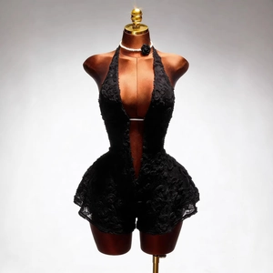 Sexy black lace halter jumpsuit with deep V-neck and 3D floral details on mannequin