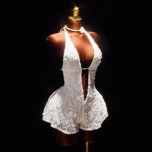 White lace backless romper with deep V-neck and halter necktie in sheer floral pattern