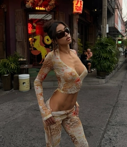 Detail of floral leopard print two-piece set with lace V-neck top and slim pants