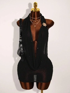 Black sequined knit halter mini dress with deep V-neck and mesh texture on mannequin