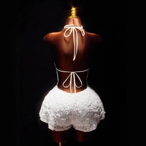 Sexy white floral lace jumpsuit with backless halter design and 3D petal textures