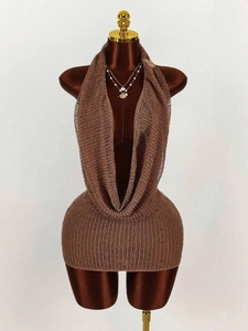 Detail of deep V-neckline on a brown mesh knit halter dress on a velvet mannequin