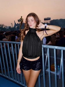 Chic black halter neck top with high collar and sparkly sequined tight shorts set