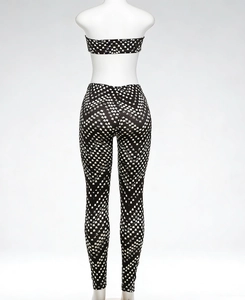 Detail of black and white pixelated checkered print on high-stretch yoga jumpsuit