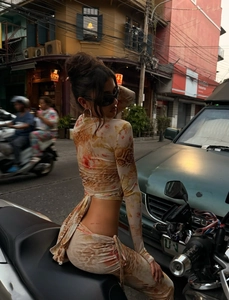 Detail of floral and leopard print crop top with back tie and ruched skirt set
