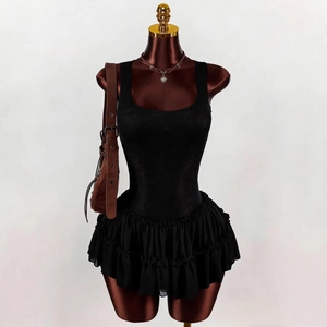 Sleeveless black tiered ruffle mini dress with ballet lace stitching and chic silhouette