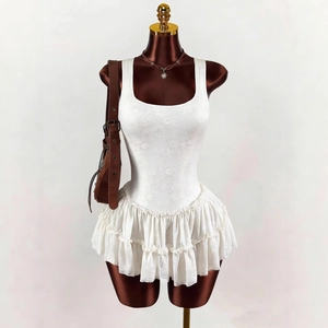 Chic white lace two-piece set featuring a slim-fit tank top and layered ruffle mini skirt