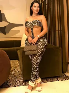 Women's chic black and white geometric print two-piece set with tube top and slim trousers