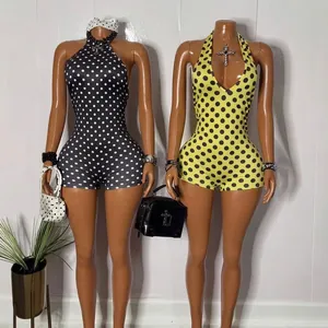 Tutina donna con scollo all'americana a pois, vestibilità aderente in nero e giallo