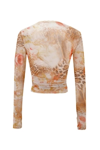 Detailed back view of V-neck printed top with lace trim and waist tie fastening