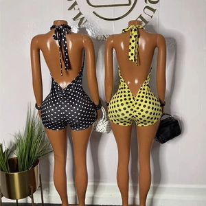 Tutina senza maniche con scollo all'americana a pois e design aderente con schiena nuda