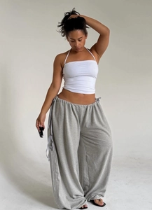 Close-up of drawstring waist and fabric texture on grey oversized wide-leg sweatpants