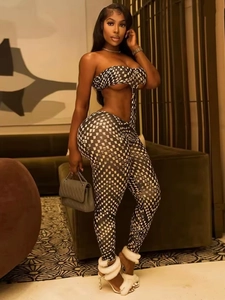 Women's two-piece set with black and white checkered crop top and high-waisted pants