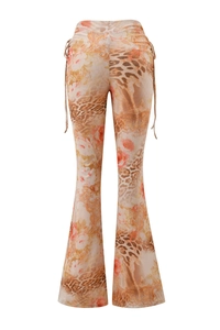Detail of high waist flare trousers with leopard floral print and side drawstring ties