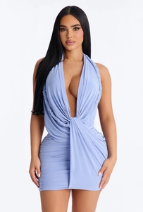 Detail of light blue bodycon dress featuring deep V-neckline and braided halter straps