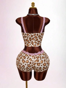 Women's leopard print two-piece set with pink lace trim crop top and slim shorts