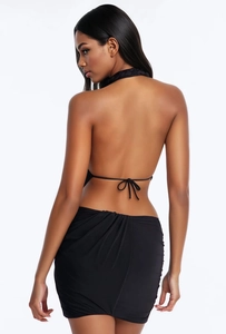 Detail of a sexy black backless halter dress with woven neck strap and lace-up back design
