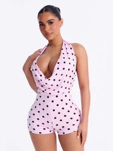 Pink polka dot halter romper for women with deep V-neck and open back design