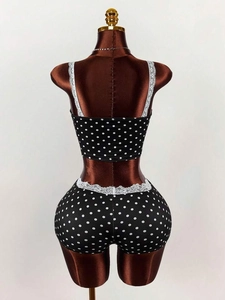 Sleeveless crop top and shorts set with white polka dots and lace trim detail
