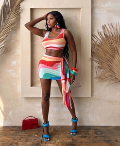 Detail of colorful sleeveless crop top and ruched mini skirt with wavy abstract print