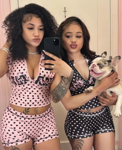 Detail view of the V-neck crop top and high-waisted shorts with polka dot patterns