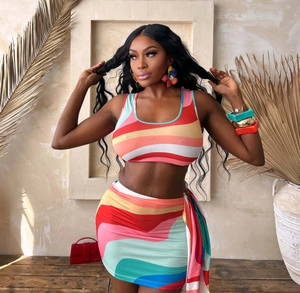 Detail of colorful wavy striped knit two-piece set featuring cropped tank top and mini skirt