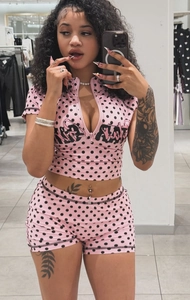 Pink polka dot two-piece sports set with NOT REALLY lettering and zipper collar