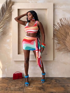 Summer beach vacation two-piece set featuring rainbow crop top and printed mini skirt