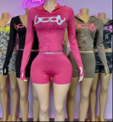 Detail of four-color slim fit sports set with zip-up hoodie, shorts and body print