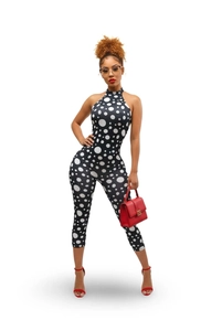 Detailed close-up of a sexy black polka dot halter neck bodysuit for summer fashion