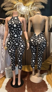 Detail view of back ruching and halter neck on a black and white polka dot jumpsuit