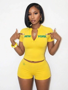 Bright yellow two-piece summer sports set with slim fit top and matching shorts