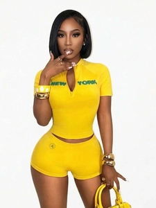 Bright yellow two-piece summer sports set with New York letter print and high waist shorts